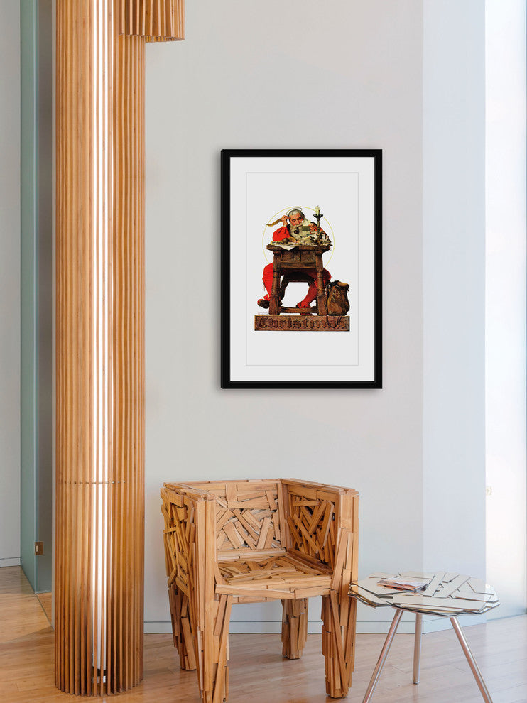"Santa at His Desk" Framed Art Print by Norman Rockwell