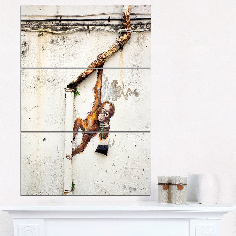"Baby Orangutan Hanging from Pipe" Street Metal Wall Art, 3 Panels, 28"x36"