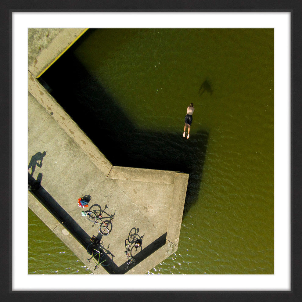 "Bikes On The Pier" Framed Print by Karolis Janulis