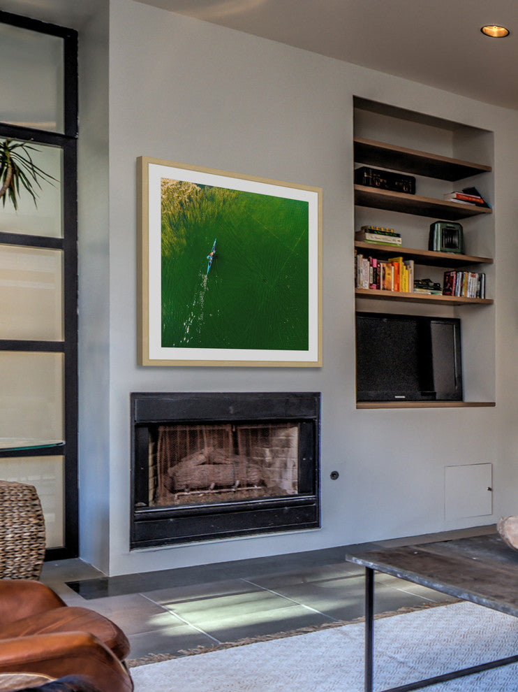 "Blue Canoe" Framed Print by Karolis Janulis