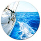 White Sailing Yacht In Blue Sea, Seashore Round Wall Art, 11"
