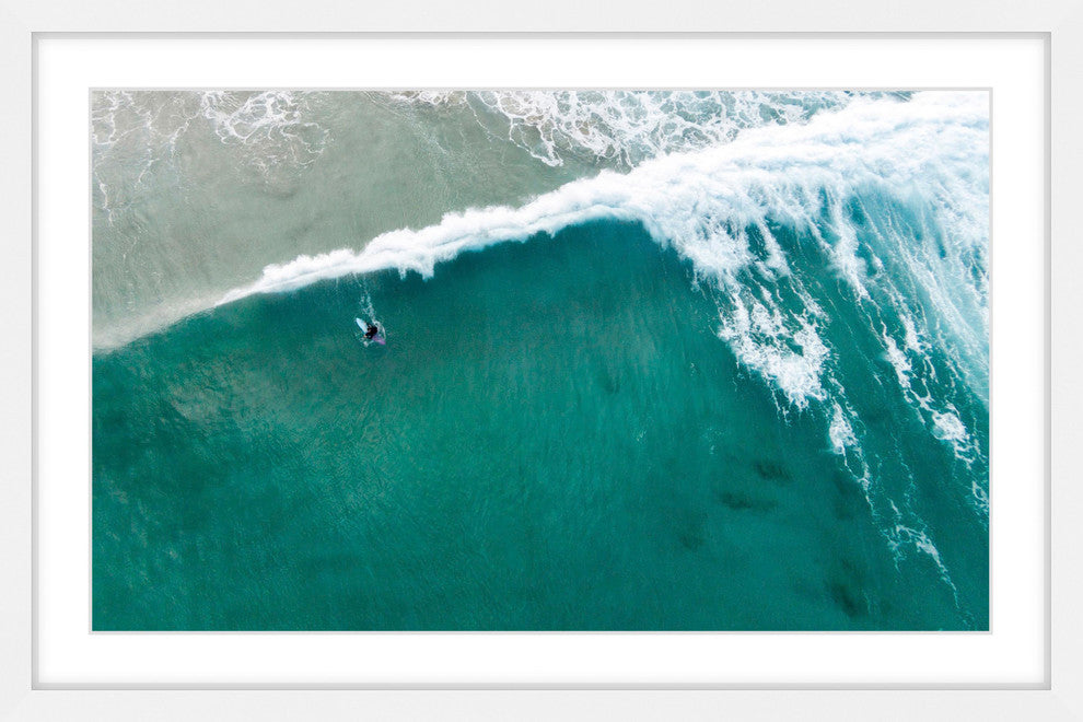 "Riding The Wave" Framed Print by Karolis Janulis