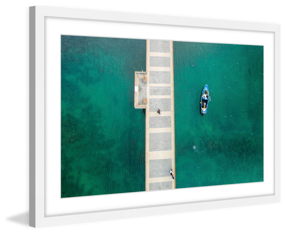 "Floating Blue Boat" Framed Print by Karolis Janulis