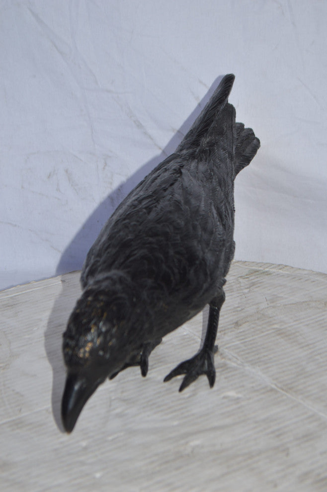 Raven with his head down Bronze Statue - Size: 22"L x 6"W x 11"H.