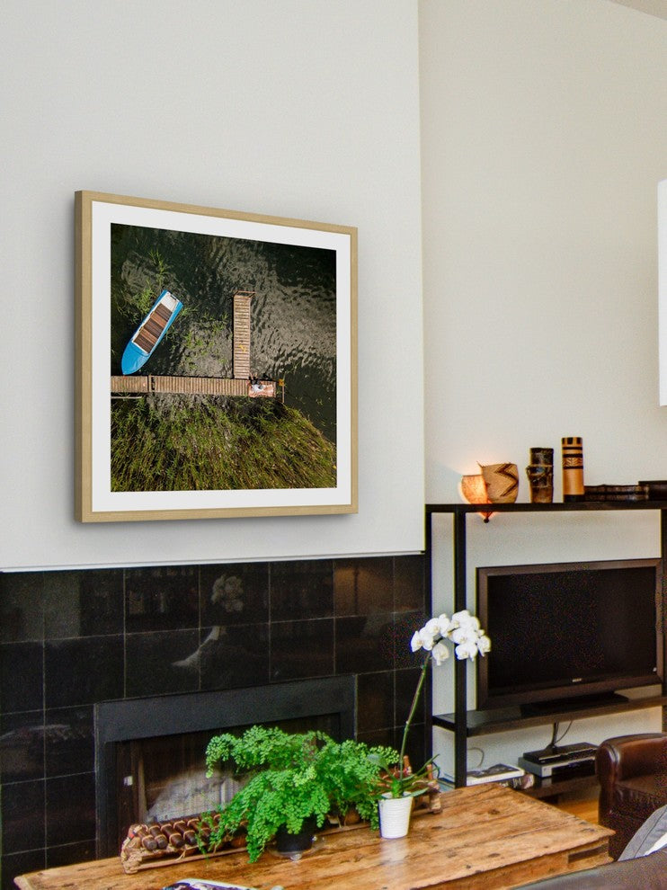 "Blue Boat" Framed Print by Karolis Janulis