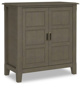 Foot/leg detail close-up on white background.