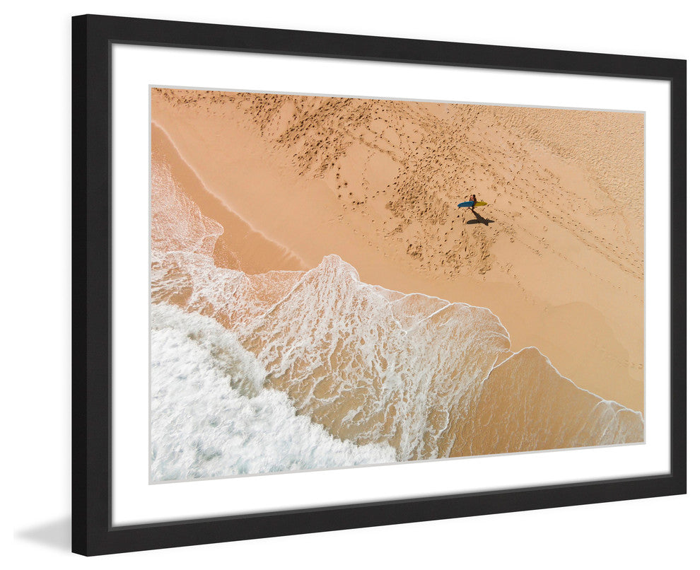 "Lapping The Sand" Framed Print by Karolis Janulis