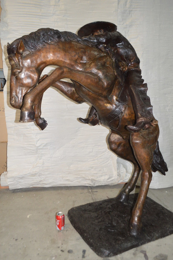 Bronco Buster Giant Bronze Statue -  Size: 65"L x 52"W x 64"H.