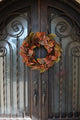 24" Artificial Magnolia Leaf Vine, Pinecones, and Berries Wreath