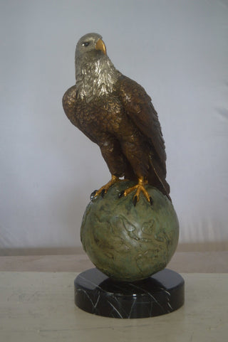 Bald Eagle Standing on a Globe Bronze Statue -  Size: 17"L x 9"W x 23"H.