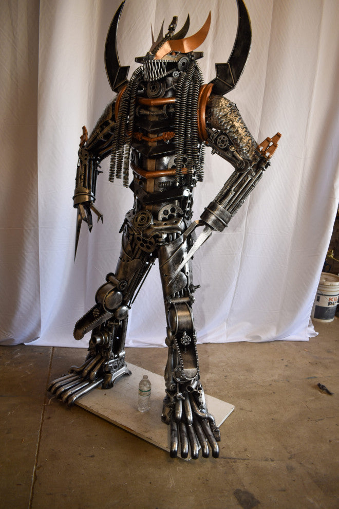 Colorfull impresive Statue of a warrier made of metal scraps 48" x 20" x 82"H