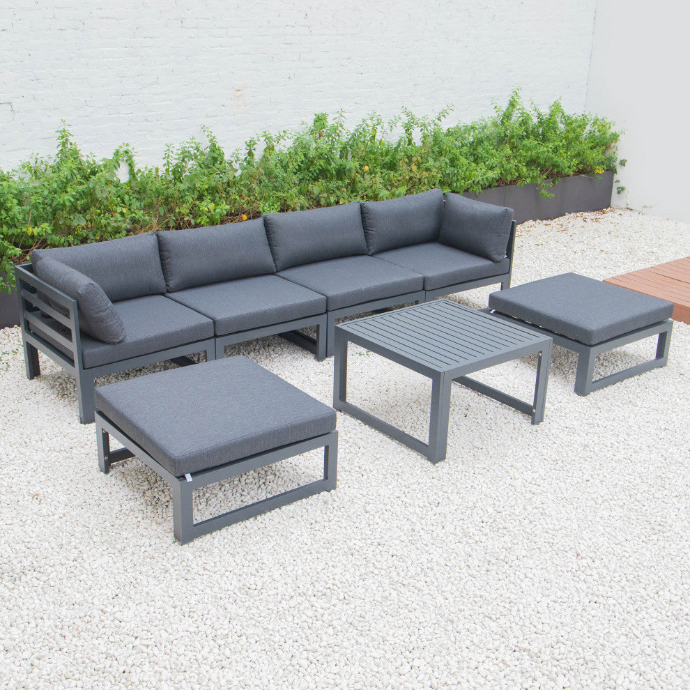 LeisureMod Chelsea 7-Piece Patio Ottoman Sectional With Coffee Table, Black