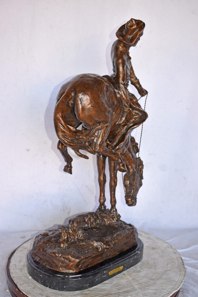 Outlaw by Remington Bronze Statue Replica - Size: 18"L x 10"W x 32"H.