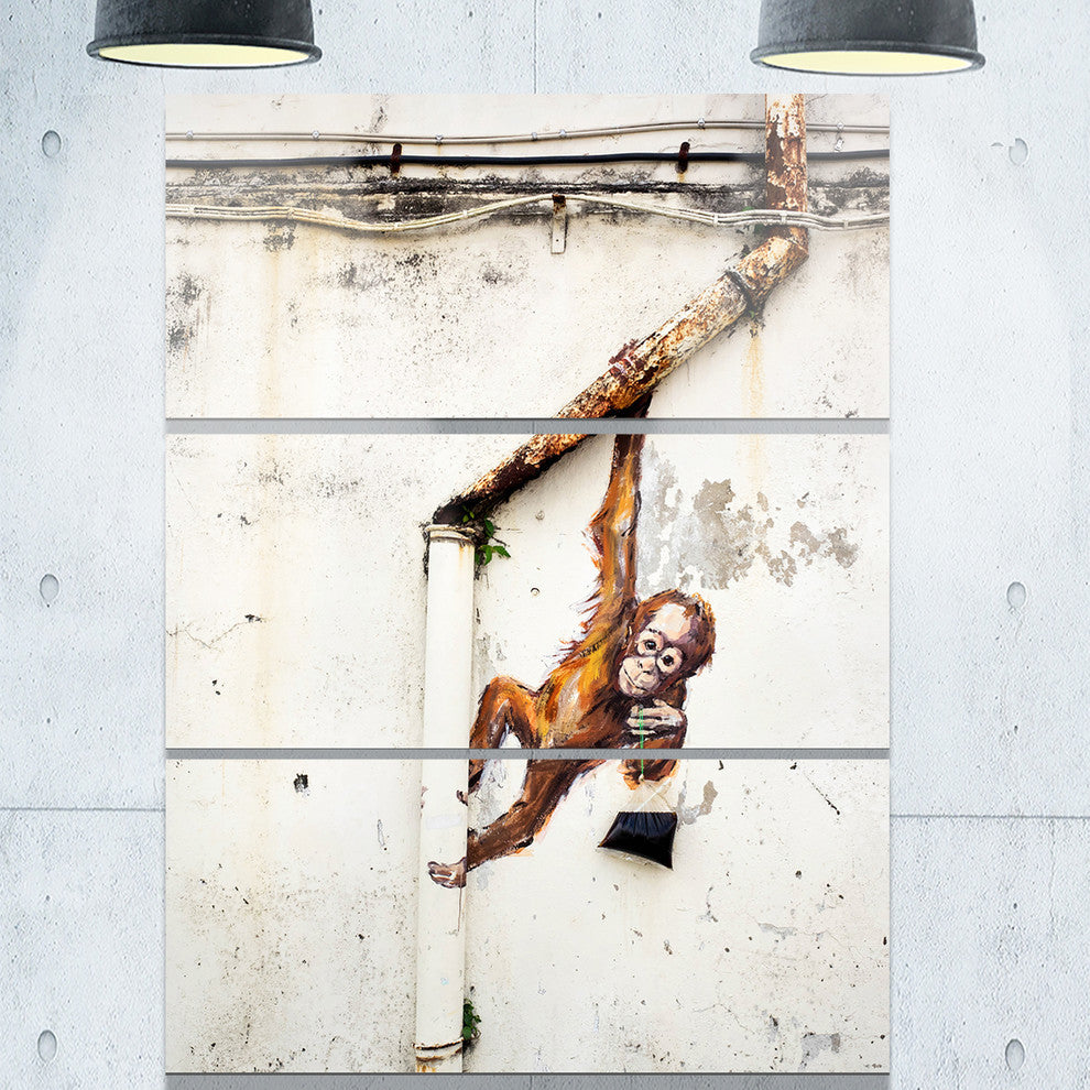 "Baby Orangutan Hanging from Pipe" Street Metal Wall Art, 3 Panels, 28"x36"