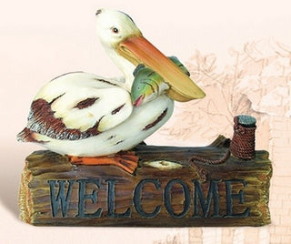 Pelican With Fish on Welcome Log