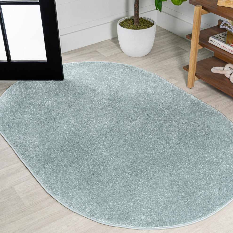 Haze Solid Low-Pile Light Blue 6 ft. x 9 ft. Oval Area Rug
