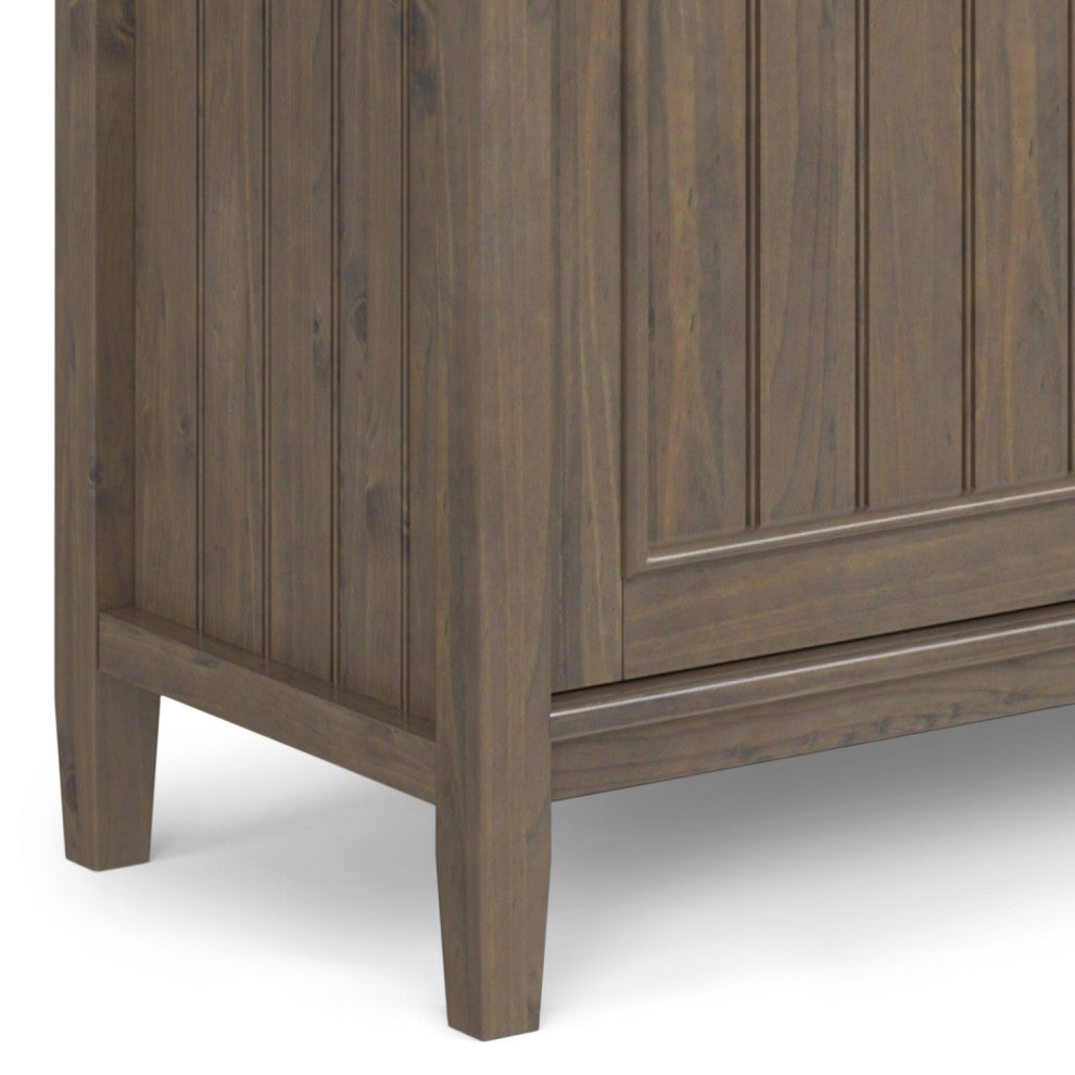 Close-up of bottom corner and leg of cabinet.