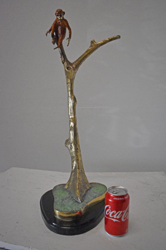 Colored Monkey Resting on a Tree Bronze Statue - Size: 12"L x 13"W x 27"H.
