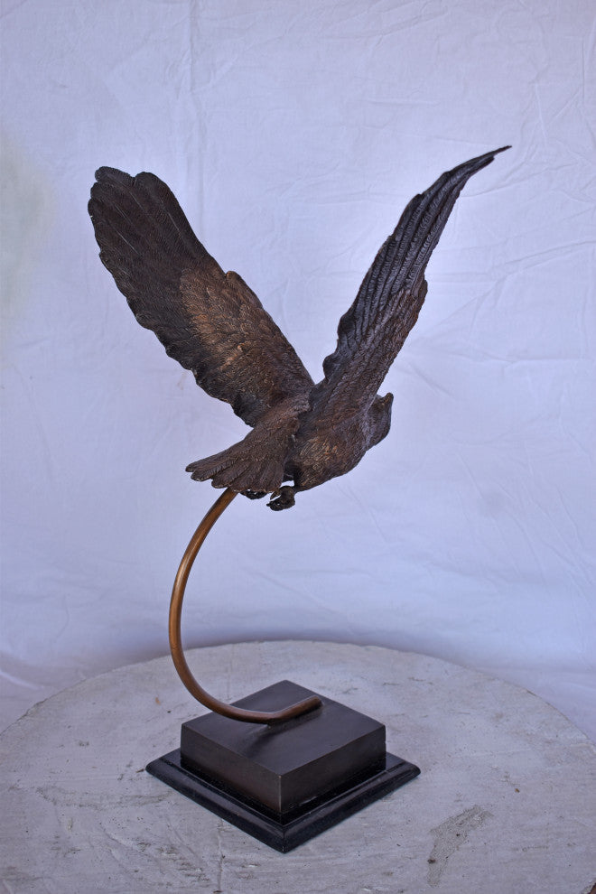Owl Searching for Prey Bronze Statue Size: 18"L x 11"W x 22"H.