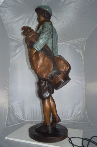 Caddy with light Bronze Statue -  Size: 30"L x 36"W x 64"H.