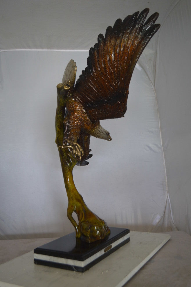 Eagle Soaring Bronze Statue by W Aribu -  Size: 35"L x 27"W x 38"H.