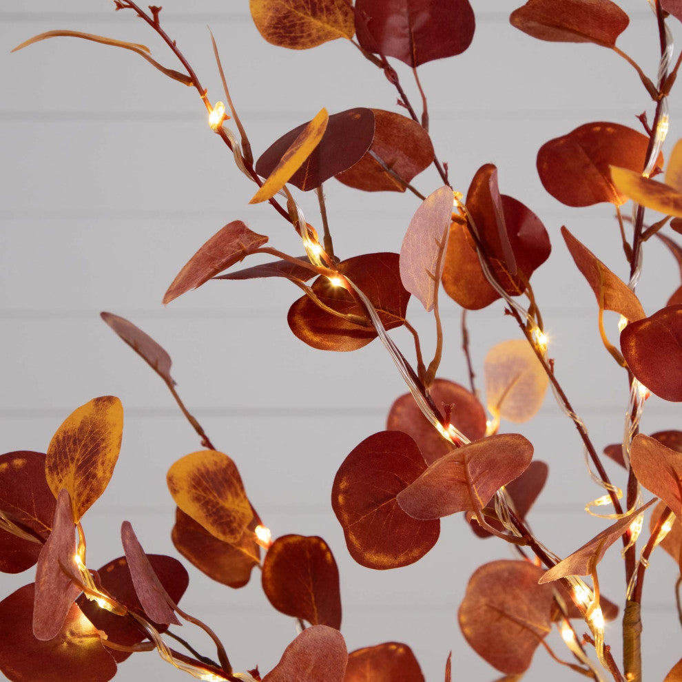 Close-up of leaves with lights on white background