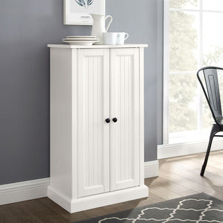 Lifestyle image showing cabinet in a living space with decor.