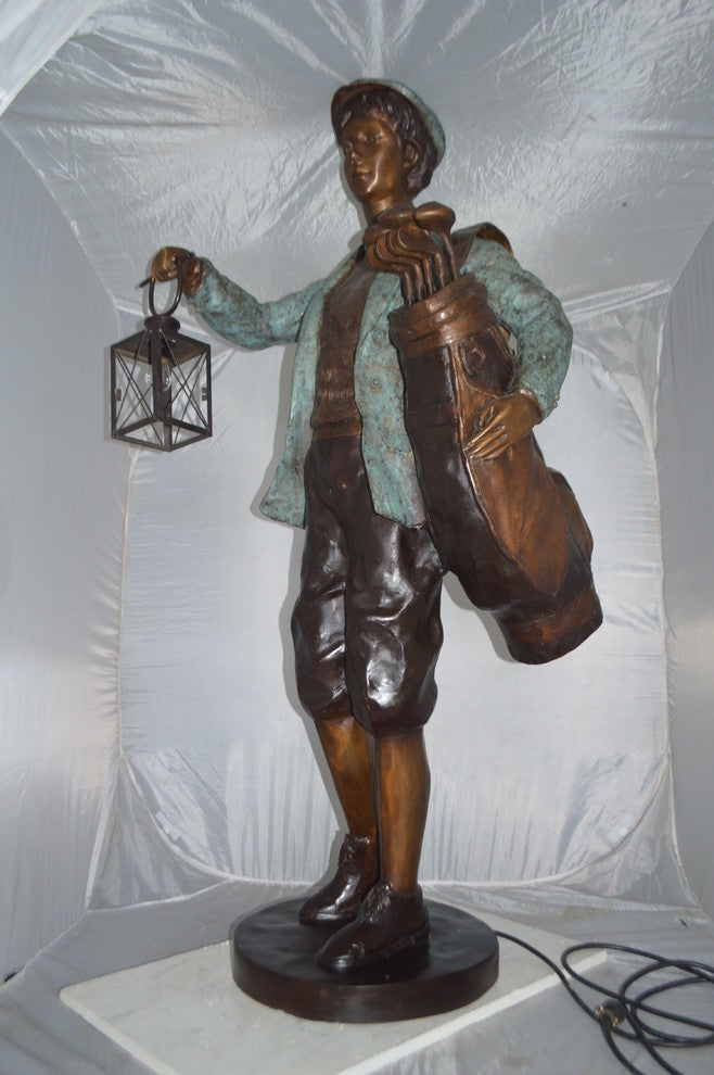Caddy with light Bronze Statue -  Size: 30"L x 36"W x 64"H.