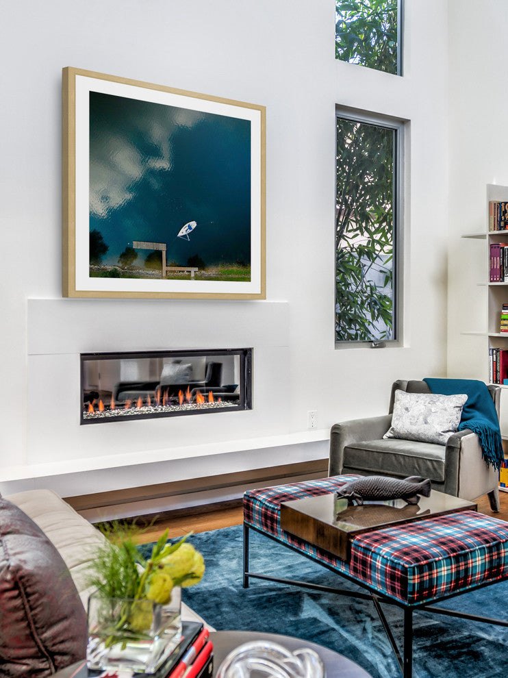 "Lone White Boat" Framed Print by Karolis Janulis