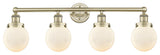 Small Beacon 4-Light 34" Vanity Light, Antique Brass Finish, Matte White Shade
