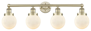 Small Beacon 4-Light 34" Vanity Light, Antique Brass Finish, Matte White Shade
