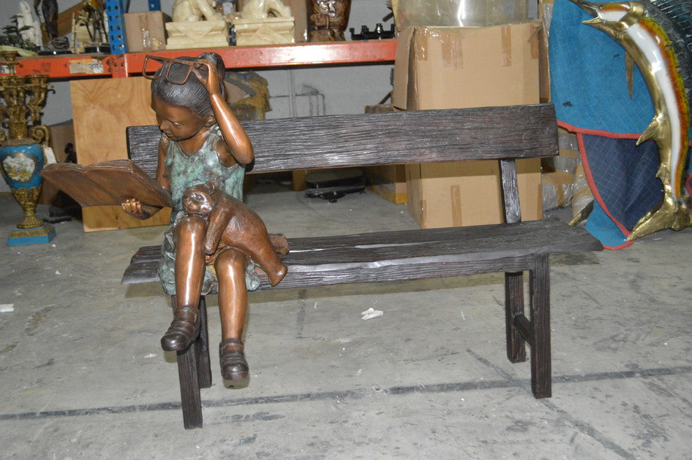 Girl with Glasses on Bench  Bronze Statue -  Size: 43"L x 20"W x 36"H.