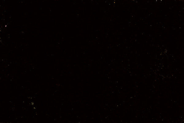 No discernible product; solid dark background with no features.