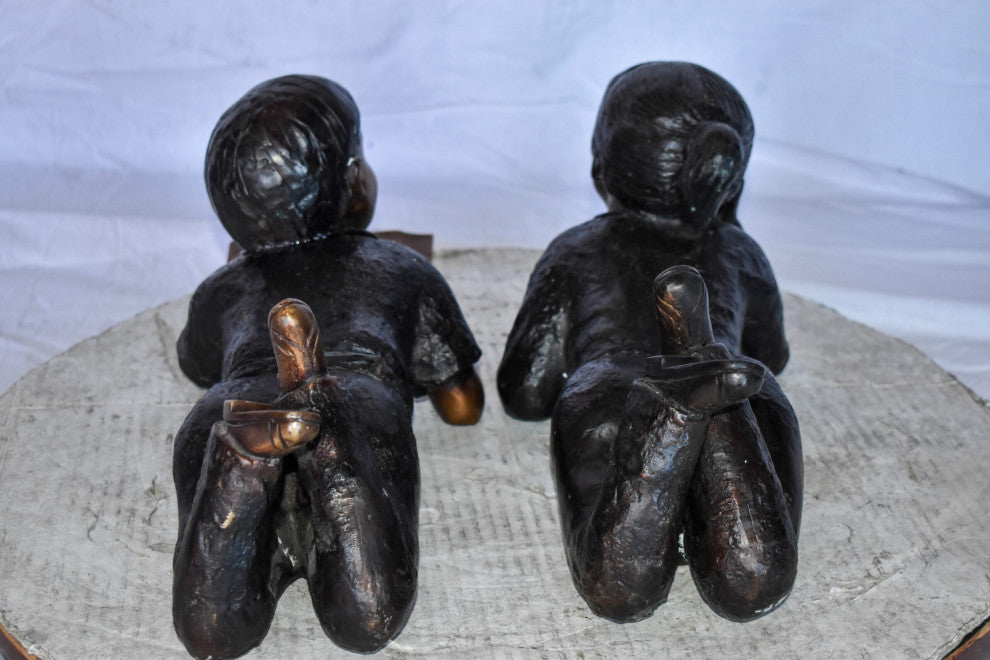 Young Kids Laying and Reading Cheerfully Bronze Statue Set Size: 20" x 13" x 8
