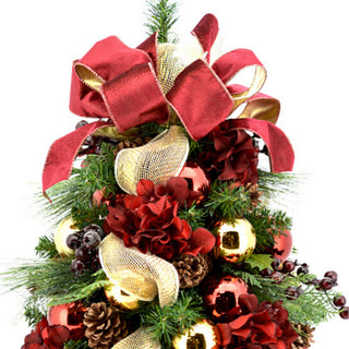 Burgundy hydrangea and berry decorated evergreen tree in ceramic pot