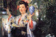 A Young Woman Holds Japanese Goods - Fine Art Giclee Print 24" x 36"