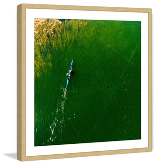 "Blue Canoe" Framed Print by Karolis Janulis