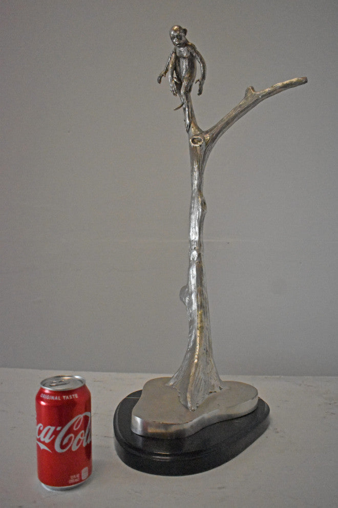 Monkey Resting on a Tree Silver Finish Bronze Statue - Size: 12" x 13" x 27"H.