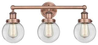 Small Edison Beacon 3-Light 25" Vanity Light, Antique Copper Finish, Clear Shade