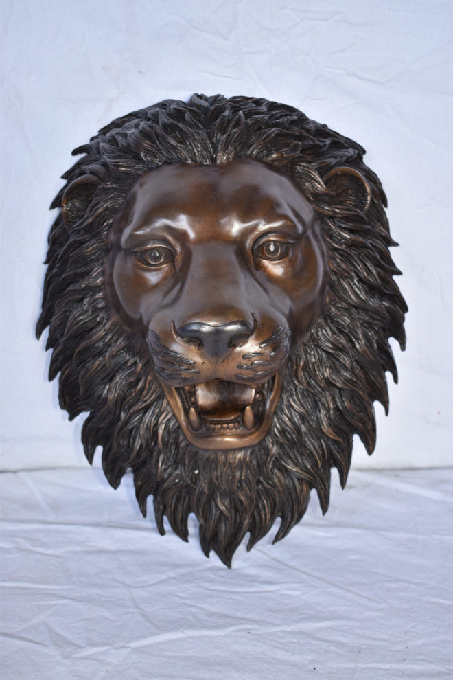 Wall Mounted Lion Face Fountain Made of Bronze Size: 12"L x 8"W x 18"H.