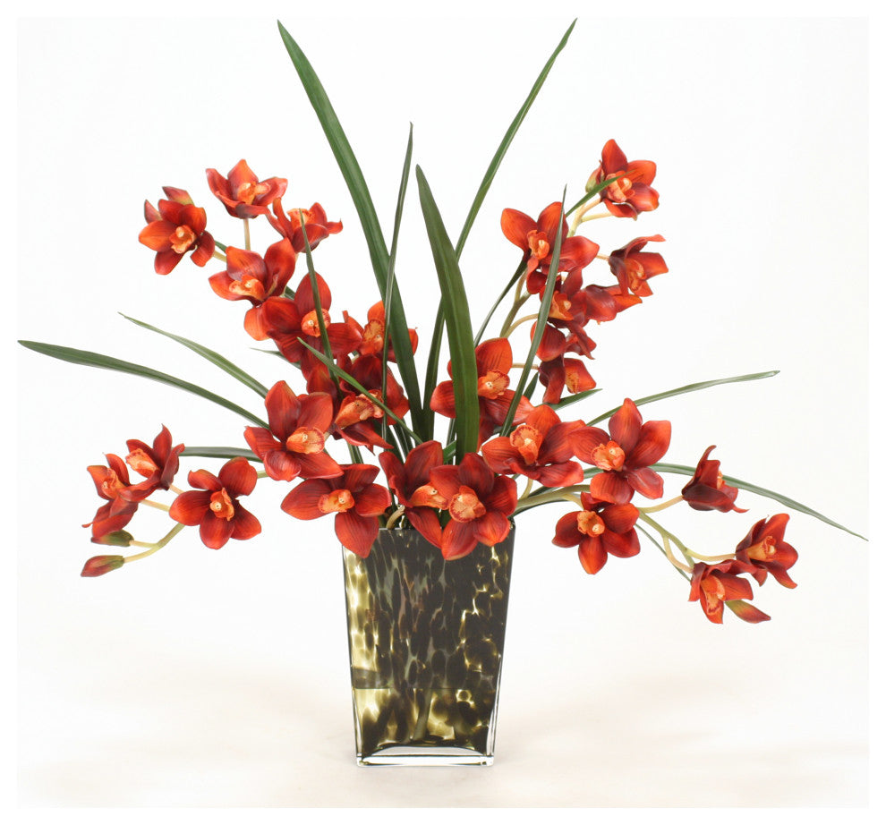 WaterlookÂ® Rust Cymbidium Orchids with Foliage in Leopard-Spotted Glass Vase