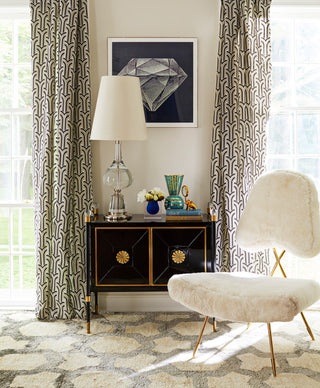 Lifestyle shot showing the cabinet in a room setting with decor.