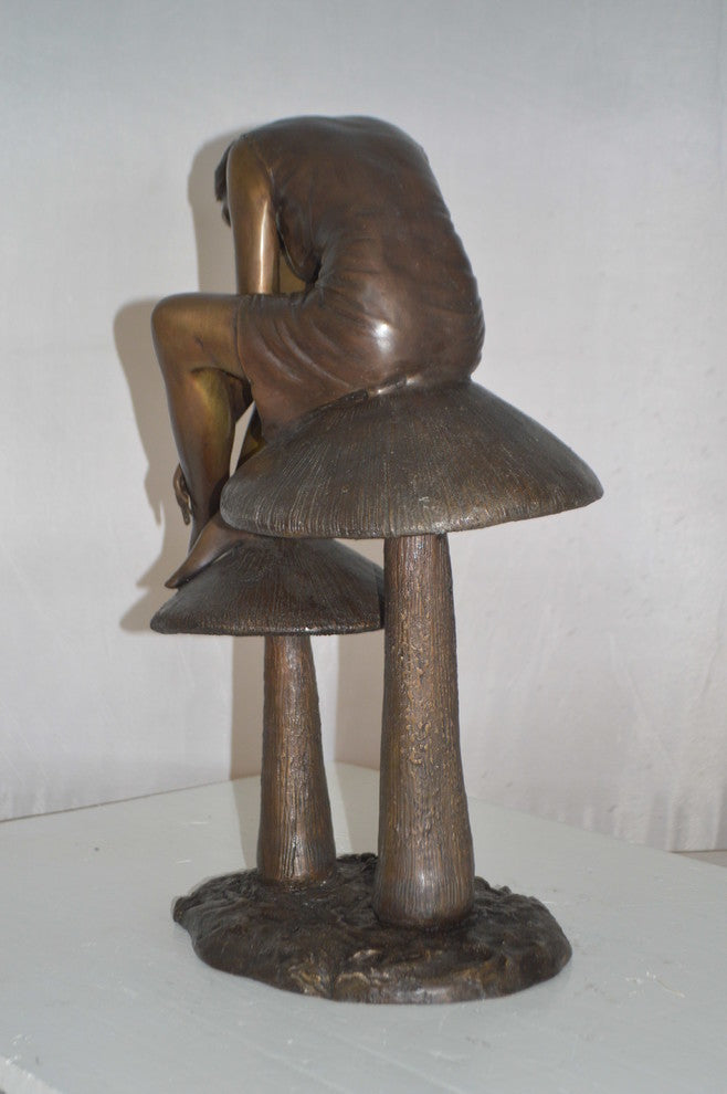 Girl sitting on Mushrooms Bronze Statue -  Size: 13"L x 11"W x 18"H.
