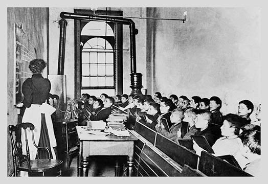 Teacher Instructs Students From Blackboard in Classroom- Canvas Poster 20" x 30"