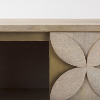 Close-up of the circular pattern texture on the cabinet surface.