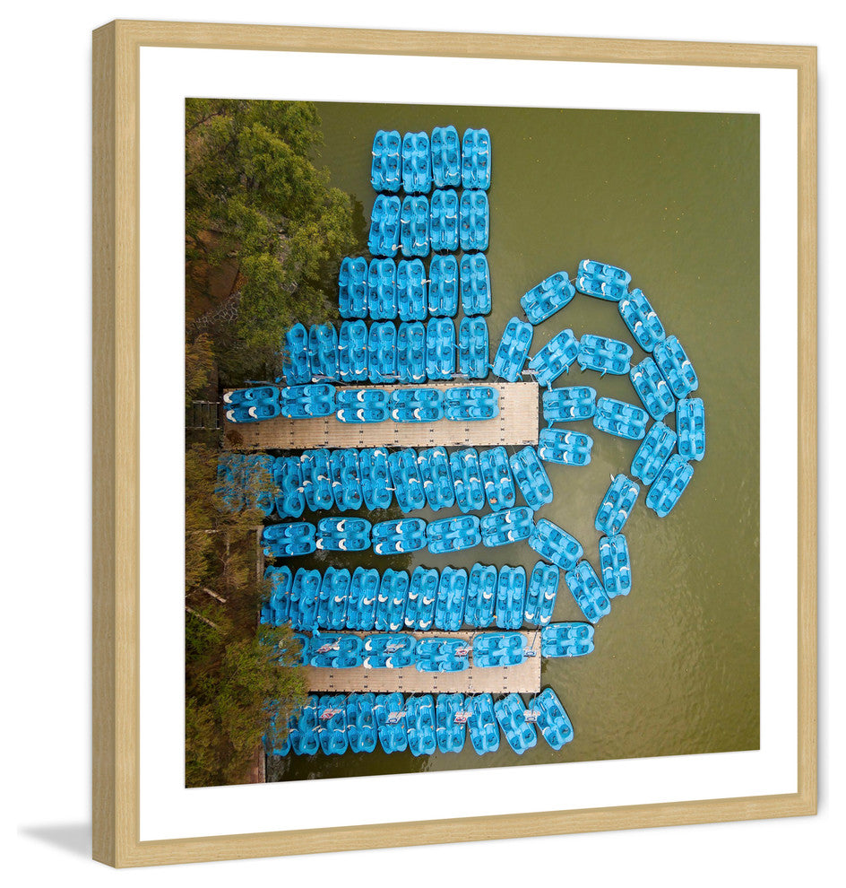 "Blue Paddleboats" Framed Print by Karolis Janulis