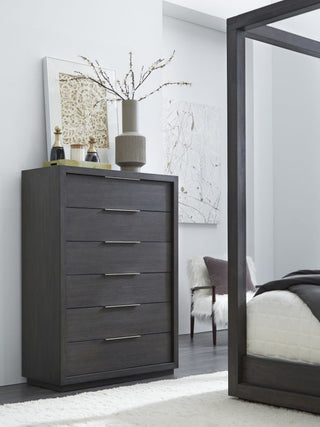 Lifestyle shot in a real bedroom setting showing the chest in use.