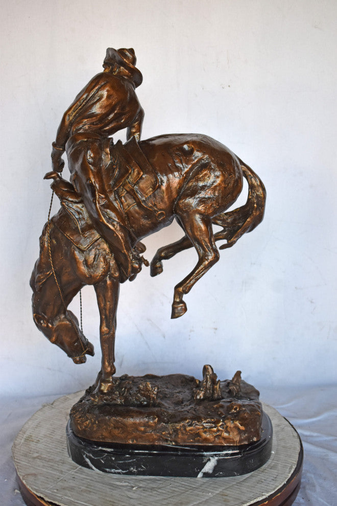 Outlaw by Remington Bronze Statue Replica - Size: 18"L x 10"W x 32"H.