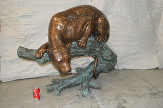 Leopard on a Tree Trunk Bronze Statue -  Size: 38"L x 34"W x 36"H.