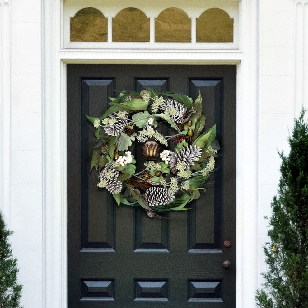 Wreath displayed on a front door in a real outdoor/entry environment (lifestyle context).